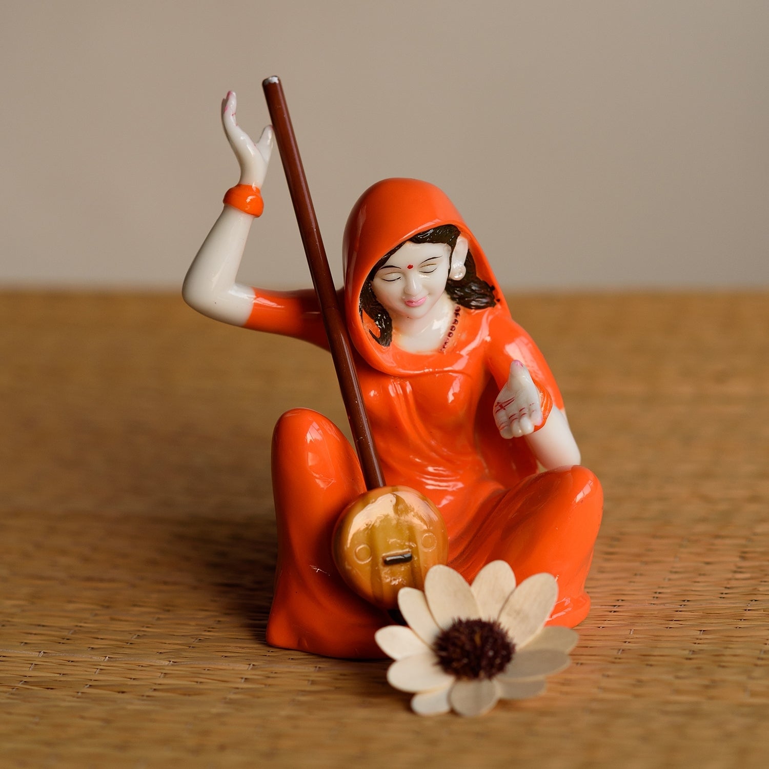 Orange Polyresin Mirabal playing Ektara Musical Instrument Showpiece Kafalo