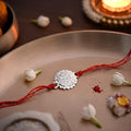 Sacred Brass Rakhi With Silver Finish Gift Set Nestasia