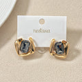 Noir Twist Statement Studs Nestasia