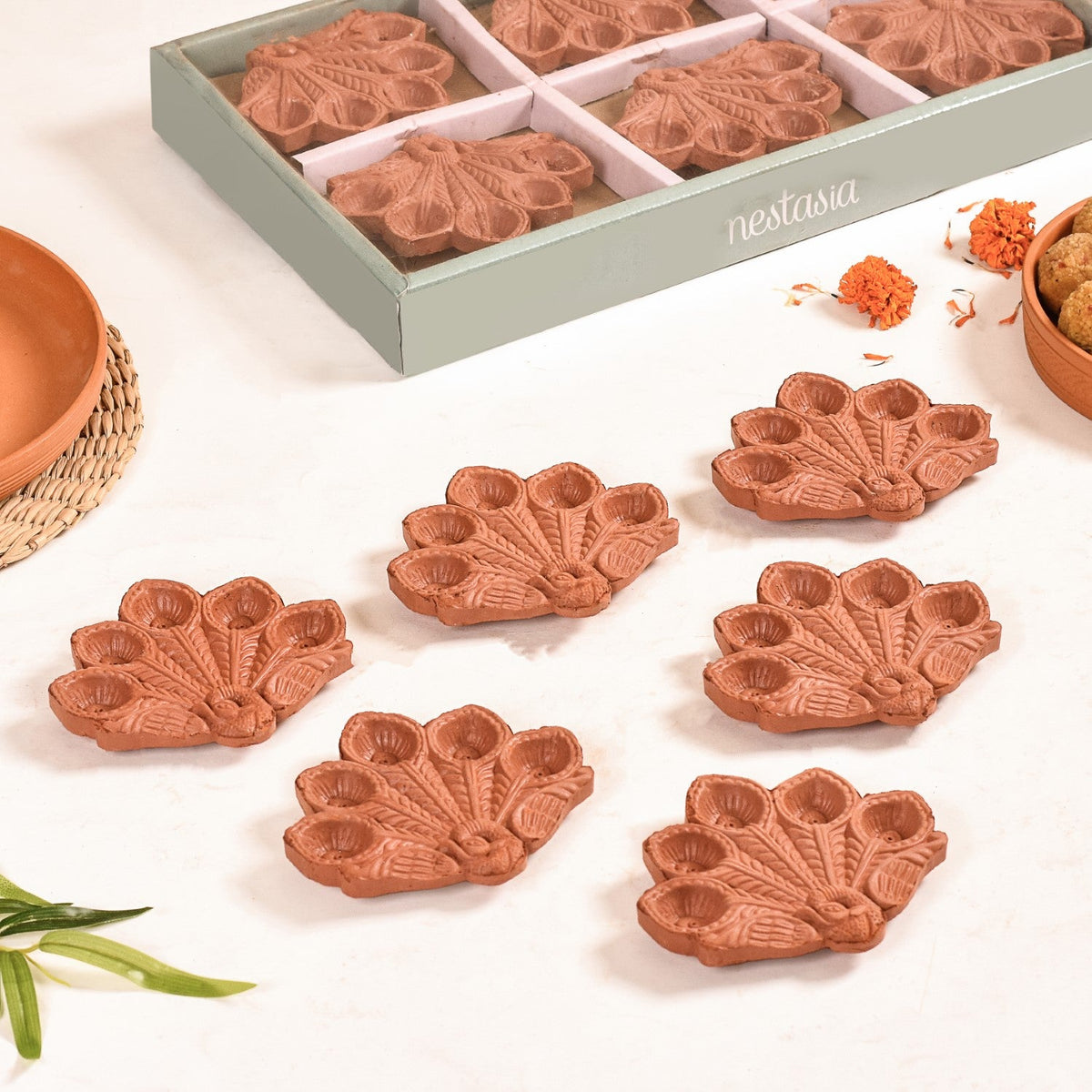 Peacock Feather Engraved Terracotta Diyas Set Of 24 Nestasia