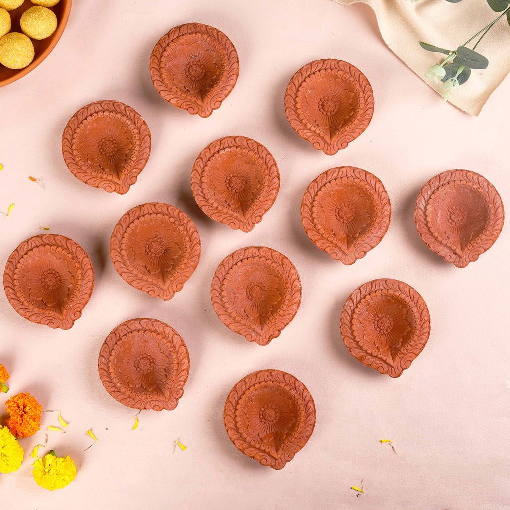 Set Of 48 Flower Motif Carved Earthen Clay Diyas Nestasia