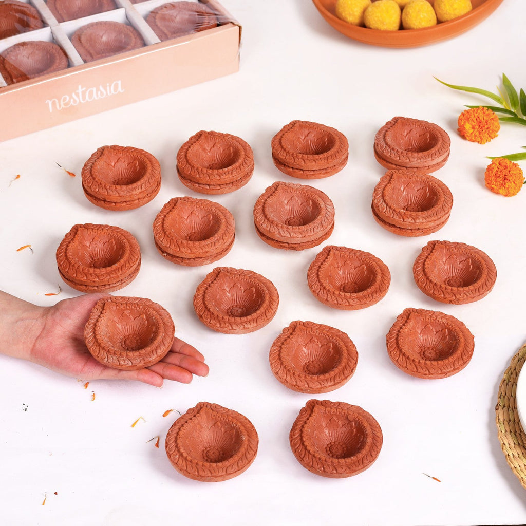 Set Of 48 Flower Motif Carved Earthen Clay Diyas Nestasia