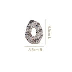 Oval Hollow Abstract Textured Silver Earrings Nestasia