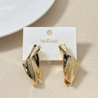 Twisted Form Drop Earrings Gold Nestasia